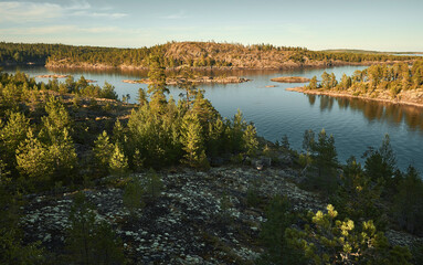 High view of the gulf, islands and forest at sunset