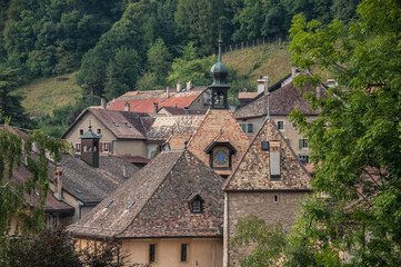 Fototapeta na wymiar General view of old, medieval, romantic and tiny Romanmontier-Envy village, located in the district of Jura-Nord Vaudois, on Nozon river in Canton Vaud, Switzerland.