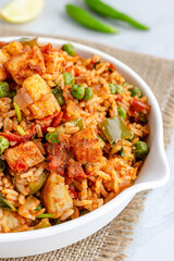 Traditional Indian Street Food Tawa Pulao with Lemon, Cilantro and Green Chili Pepper Close Up Vertical Photo