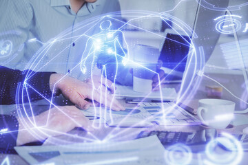 Science hologram with man working on computer on background. Concept of study. Double exposure.