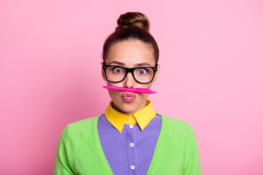 Photo of crazy careless high school girl have pen lips nose want comic joke her friends university students wear shine clothes isolated over pink color background