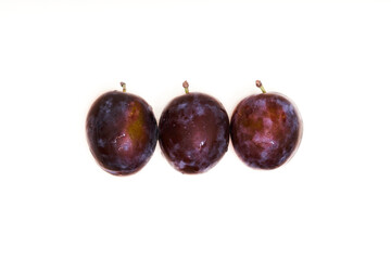   Three plums on isolated white background       