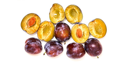Several natural ripe plums on white background