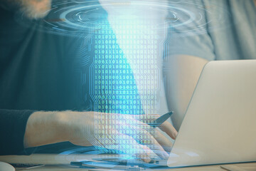 Fototapeta premium Multi exposure of data internet theme hologram with man working on computer on background. Concept of innovation.