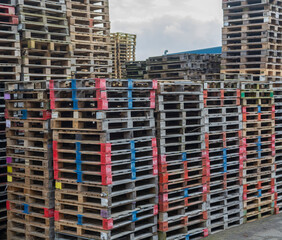 area with large stacks of euro palets ready for recycling