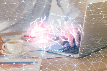 Businessman with computer background with brain theme hologram. Concept of brainstorm. Multi exposure.