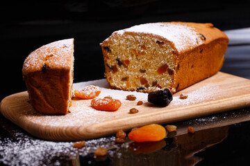 Sweet cupcake in the shape of bread. Cupcake with raisins, dried apricots, plums.