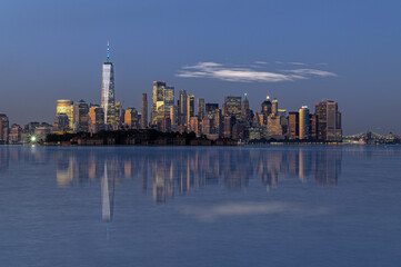 Fototapeta na wymiar Reflections of New York city skyline at sunset