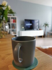 The cup of coffee on the table