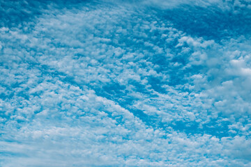 Fototapeta na wymiar Blue cloudy sky with white clouds.