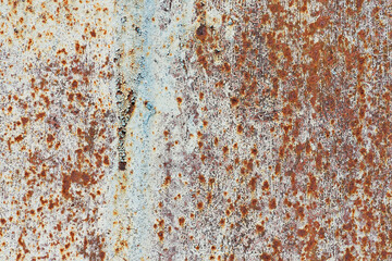 Metallic texture. A fragment of rusty metal sheet close-up.