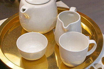 Tea set at gold tray