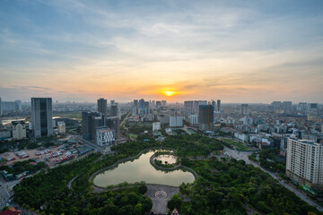 Cityscape of Hanoi skyline at Cau Giay park during sunset time in Hanoi city, Vietnam