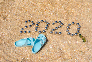 Fototapeta na wymiar number 2020 on the sand