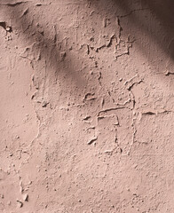 Old wall. The cracked plaster. Light pink wall
