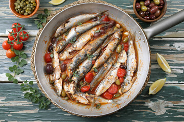pesce azzurro sardine gratinate con pomodor e olive
