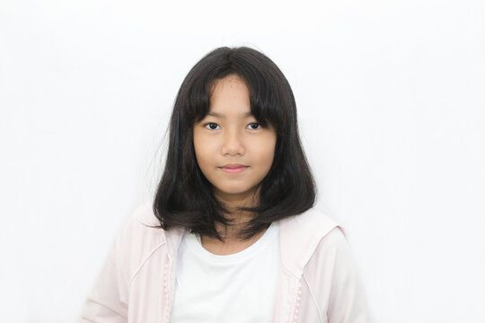 Asian cute young girl with bright face on white background
