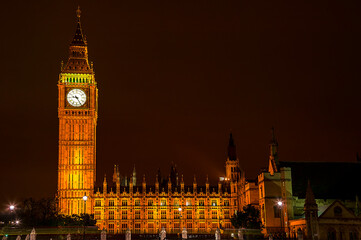 Fototapeta na wymiar Big Ben of the Houses of Parliament London England UK at night with car light trails which is a popular tourism travel destination visitor landmark of the city stock photo