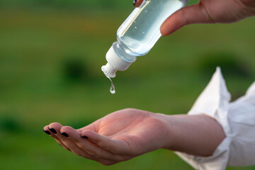 Using alcohol antiseptic gel,prevent infection,outbreak of Covid-19, woman washing hand with hand...