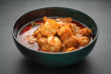 Moo Chamuang, Thai food, sweet, sour and spicy curry pork with Cowa leaves (Garcinia cowa Roxb. ex Choisy), famous local food of  Rayong, Chanthaburi and Trat provice