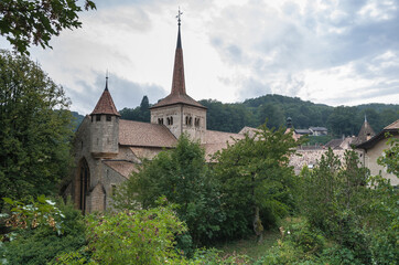View of Romainmotier Abbey Church in Romanmontier-Envy village, one of the oldest Romanesque churches in the country,  Canton Vaud, Switzerland.