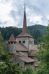 View of Romainmotier Abbey Church in Romanmontier-Envy village, one of the oldest Romanesque churches in the country,  Canton Vaud, Switzerland.