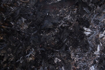 Burning dry leaves. Charcoal leaf background