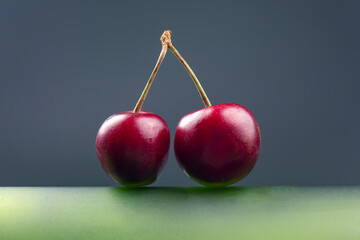fresh cherry berry on a green bottle. healthy food for breakfast. fruits of vegetation. fruit dessert