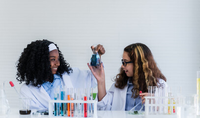 Two girl student friends with different types of skin together