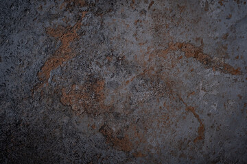 The black texture of the concrete wall is a rough shape. The old stone floor grunge