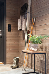 Old skis in a modern wooden cabin. Beautiful Scandinavian design.
