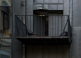 Dark metal facade with balcony at backstreet, Kiev, Ukraine