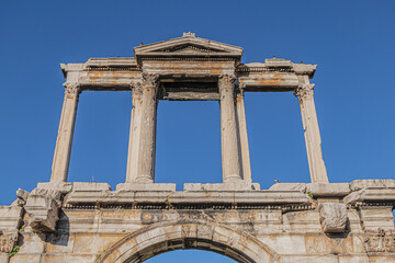 Famous Hadrian's Gate or Arch of Hadrian - one of the main landmarks of Athens. Arch of Hadrian erected in honor of Roman emperor Hadrian in 2nd century A.D. Athens, Greece.