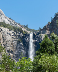 Fototapeta na wymiar Vertical view of Bridalveil Waterfall in Yosemite National Park with a clear blue sky