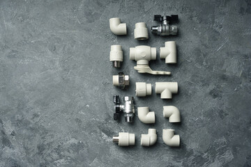 Plumbing details close-up with copy space on a stone background