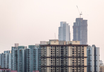 Fototapeta na wymiar Cityscape of suburban Mumbai with construction work on buildings