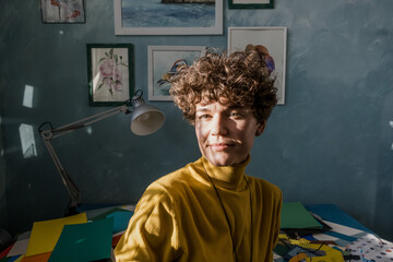 Woman in a studio office working with paper collage