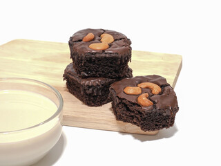 Dipping brownie in to milk is good for health, handmade chocolate brownie, cooking at home concept