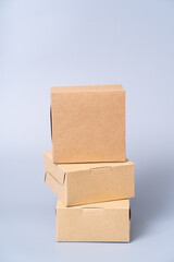 Brown paper box for food package. carton on a gray background.