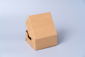 Brown paper box for food package. carton on a gray background.