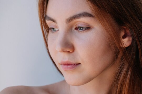Closeup beauty portrait of young woman with natural looking make up