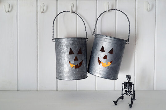 Metal tins with candles for Halloween