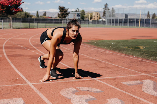 Woman Starting to Run on Track