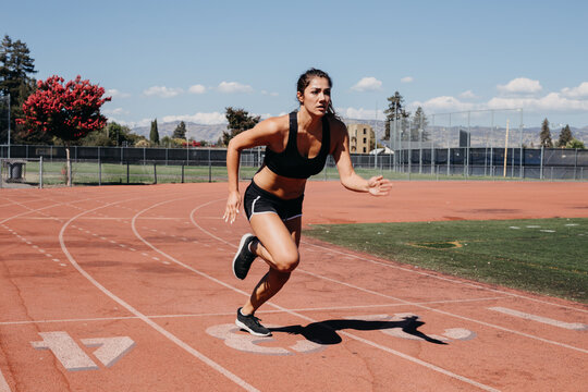 Woman Starting to Run on Track