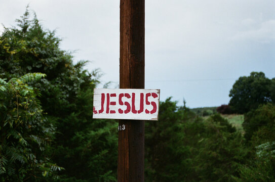 Red Jesus sign on telephone pole