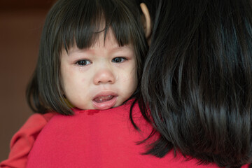 Obraz premium Asian little girl sad and crying