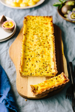 Passionfruit tart with slice cut vertical
