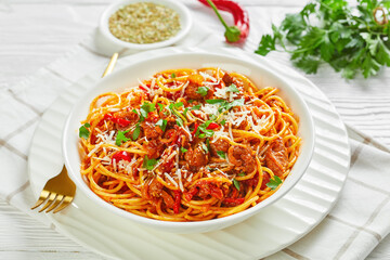 spaghetti with pork ragout, tomatoes, veggies, spices