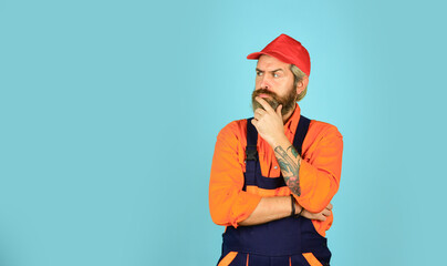 mature repairman in uniform. foreman wear boilersuit. Laborer man in working clothes. builder in working overalls. Engineer industrial building. Repair advertisement. Builder or plasterer. copy space