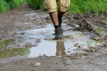 Walking with boots through a puddle
